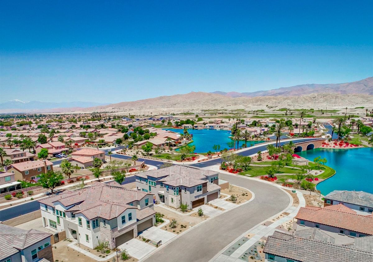 Nestled on a unique corner lot, the house offers stunning views of the mountains, park, and lake, with a picturesque European-style bridge spanning across the water.