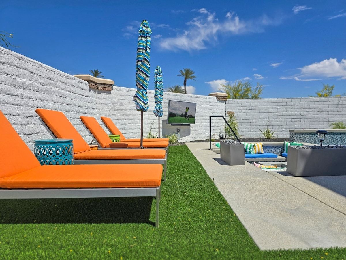 Relax poolside on vibrant loungers, perfect for soaking up the sun in your own private resort-style retreat