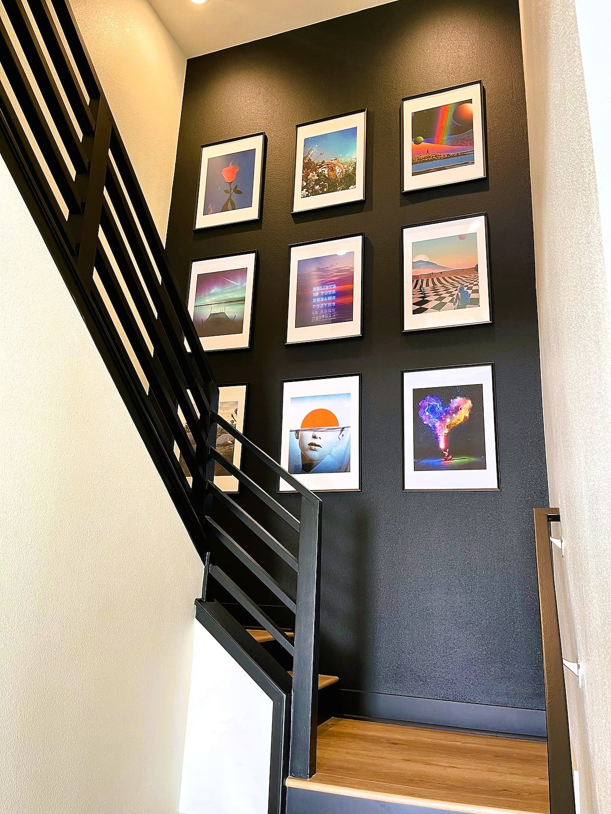 Ascend in style with this modern stairway adorned with stunning art—each step a journey into luxury
