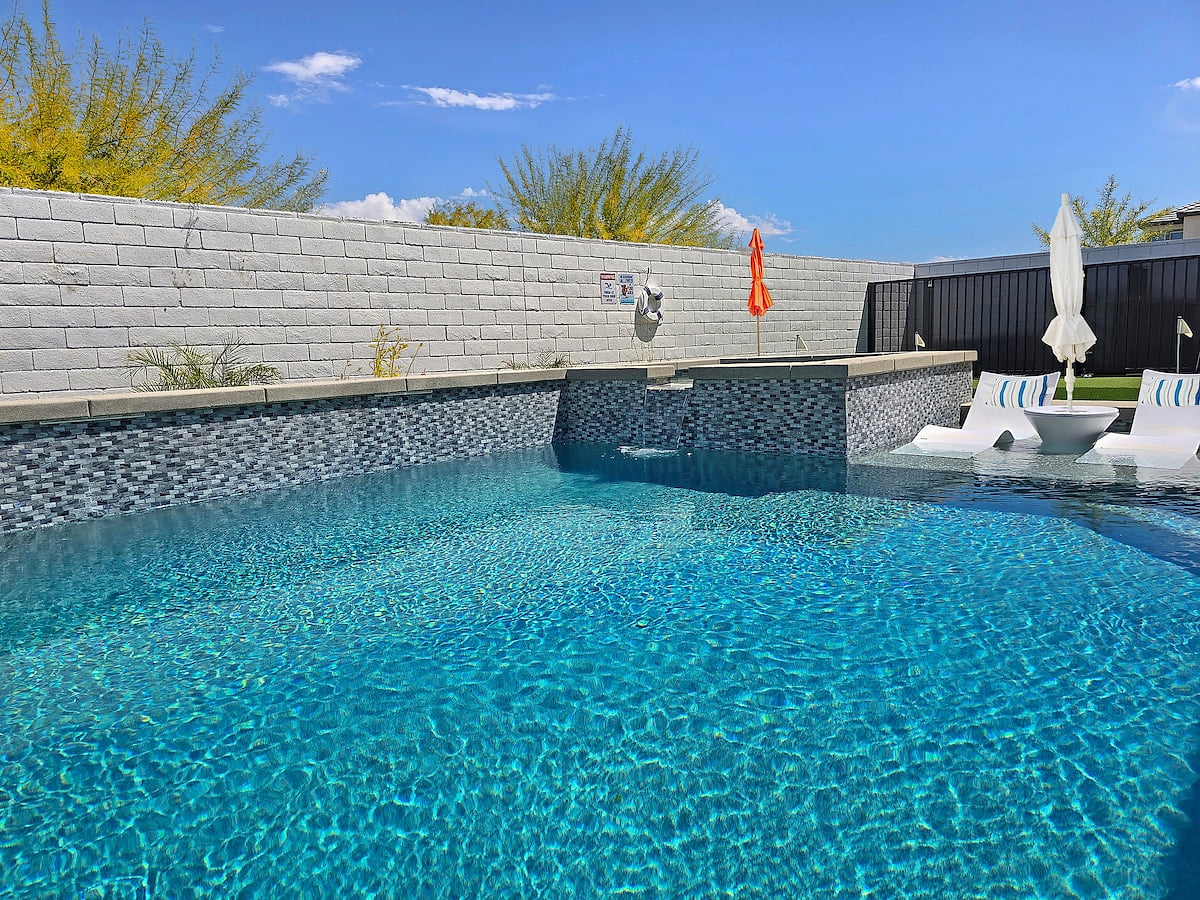 The pool offers the best of both worlds with in-water and poolside lounge chairs, ensuring you can relax and have fun in style.