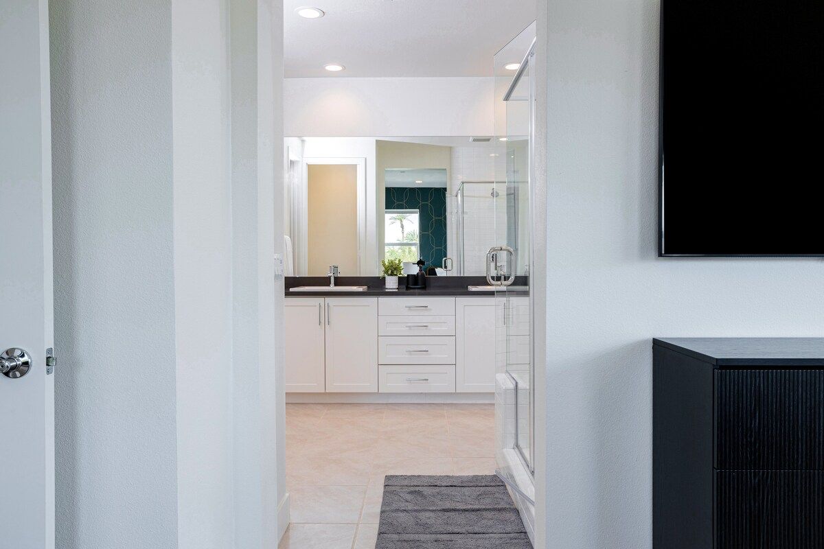 The spacious private bathroom in the primary bedroom.