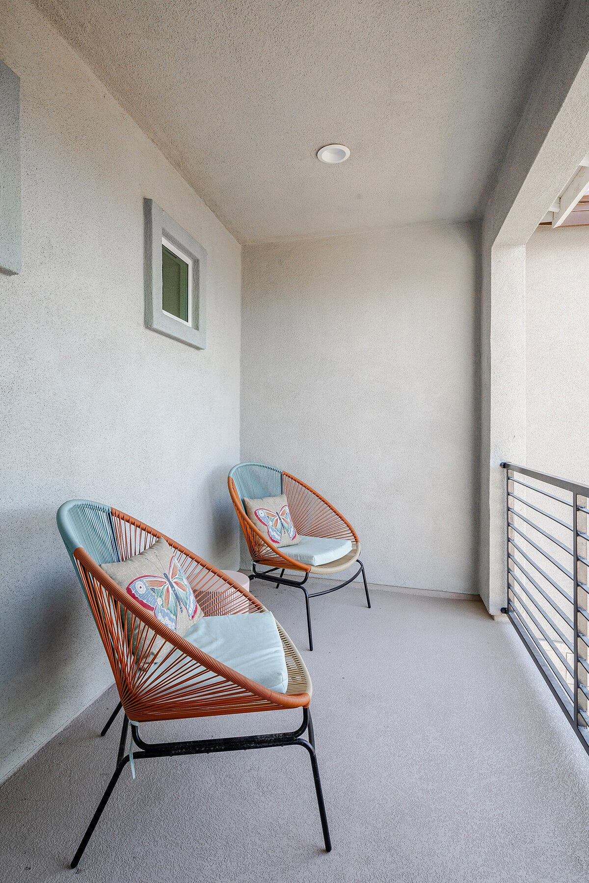 This private balcony offers a peaceful retreat, perfect for quiet moments while taking in the breathtaking mountain and lake views