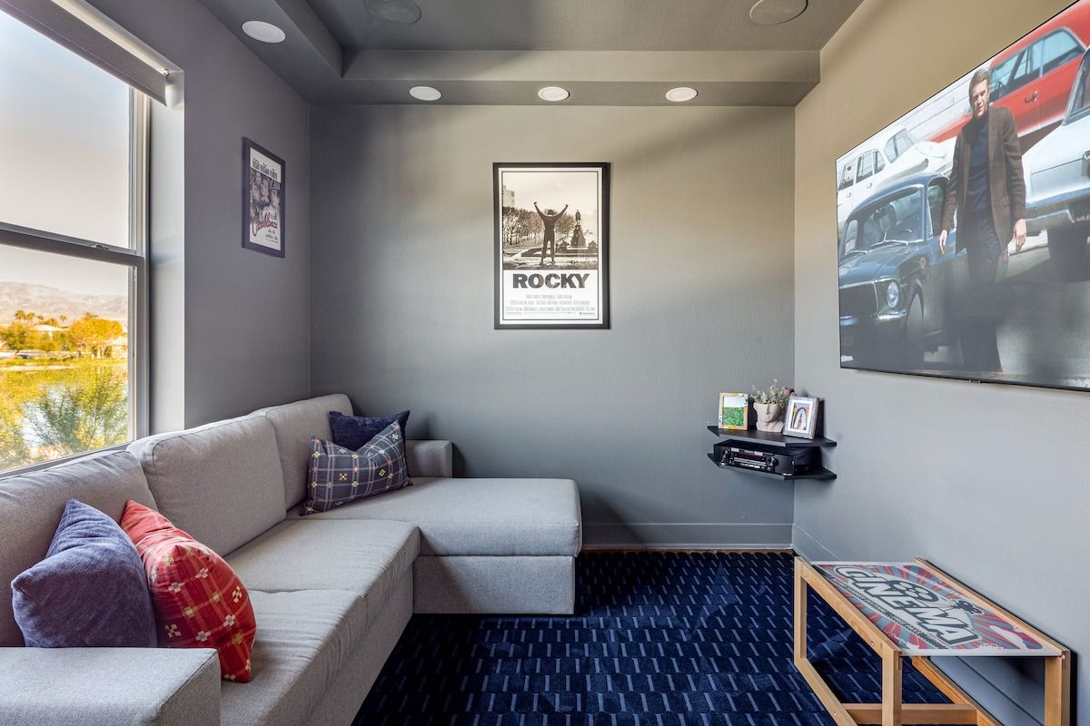 Cozy up in the TV room featuring a large screen and immersive surround sound — your private home theater experience