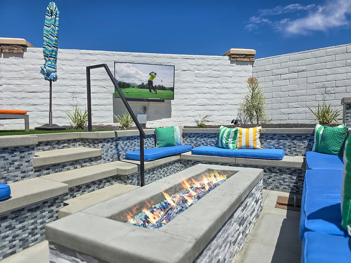 Relax with friends and family around the sunken fire pit, complete with cozy pillows, embraced by the desert's evening breeze. Enjoy your favorite movies or games on the outdoor 65" TV.