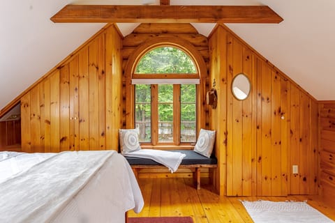 Sitting window found in Bedroom 1 (Large Loft). Views of backyard, fire pit, and perennial gardens.