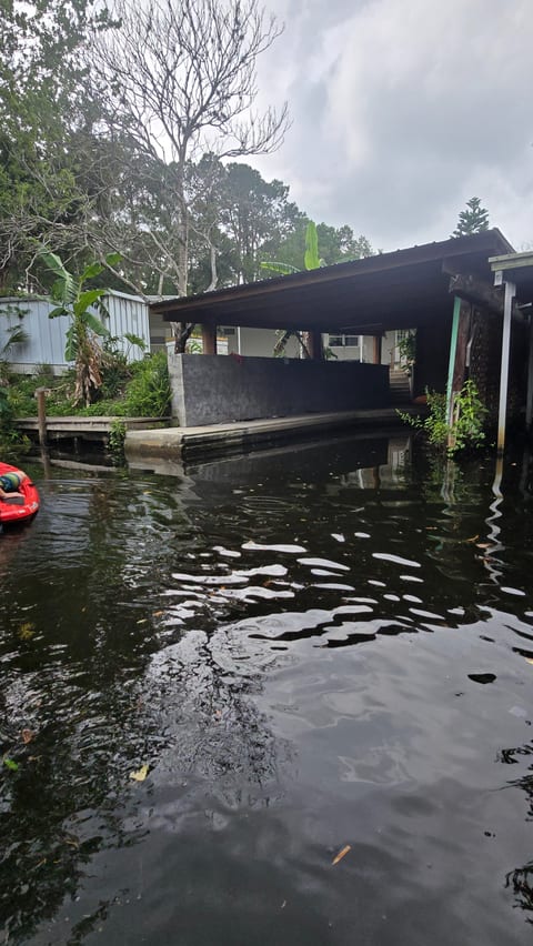 View of boat parking and/or kayak put in from river house is behind in pic