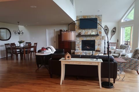View from the kitchen of LR and dining area. Relax by the fire while enjoying TV and the view.