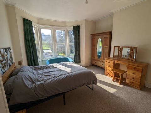 Master bedroom with a view of the park
