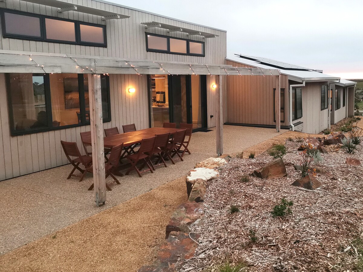 North-facing patio with 8-seat outdoor setting.