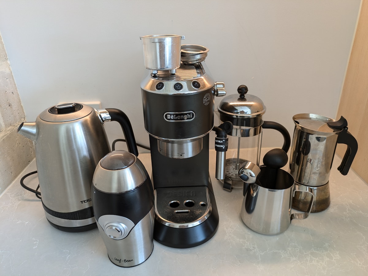 Kettle, coffee grinder, espresso machine, plunger, stovetop coffee maker.