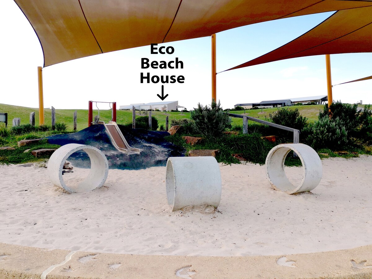 Playground slide and sandpit.