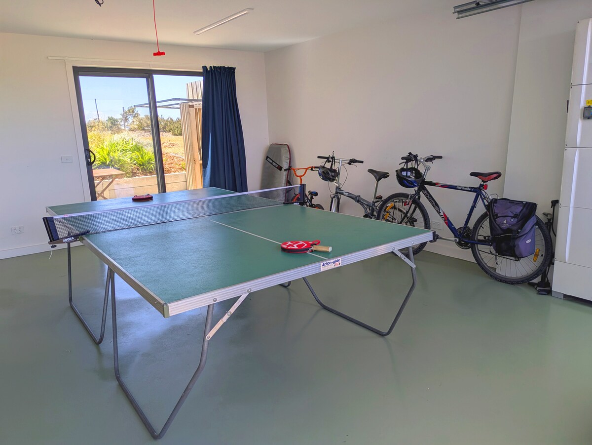 Table tennis table and bikes.