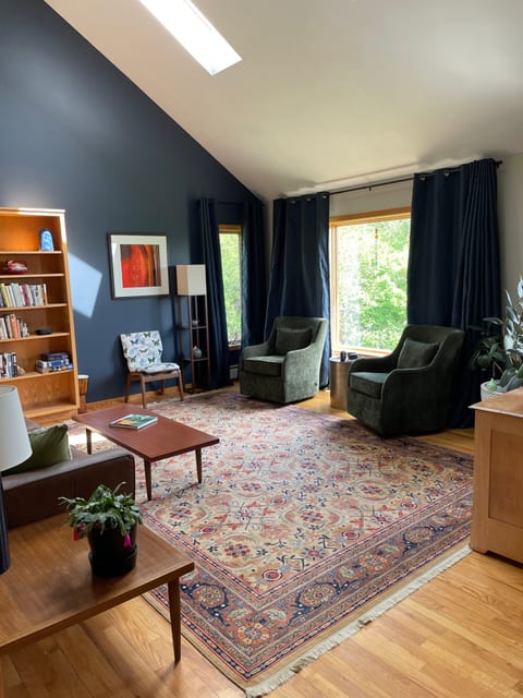 Spacious living room with skylights and vaulted ceiling