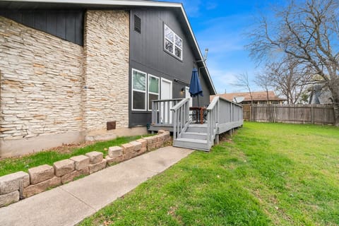 This backyard is to die for! Great for pets and hanging out on the deck. Complete with a table and chairs and umbrella for the rain, enjoy this patio and backyard that also has a grill for those July 4th festivities!