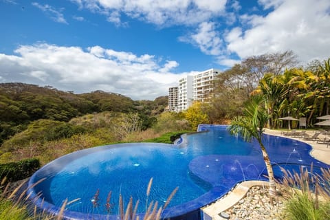 Opposite perspective of the pool that's just one minute from the front door