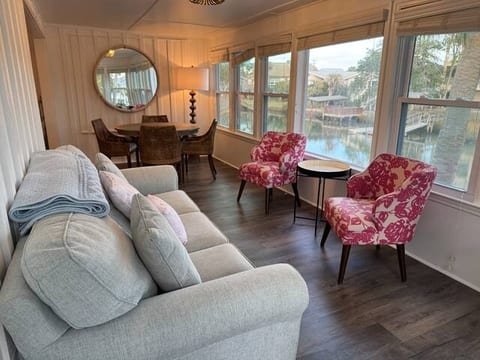 Living area where windows overlook creek