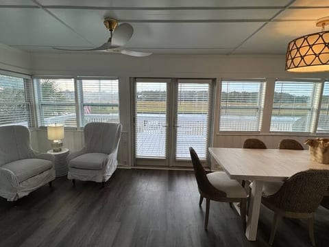 Porch entry into home with marsh view