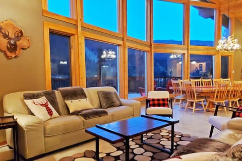 We'll start the inside tour with a handful of sample pictures of what to expect.  Here is the living room looking toward the grand table.