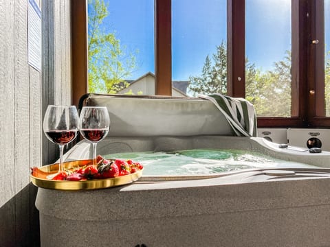 Relax in the hot tub with your favorite beverage. Enjoy a screened-in porch for added privacy and bug control!