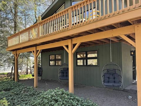 Relax beneath the deck in one of our cozy hanging egg chairs, the perfect shaded spot for morning coffee, afternoon reading, or unwinding after a day exploring the Poconos.
