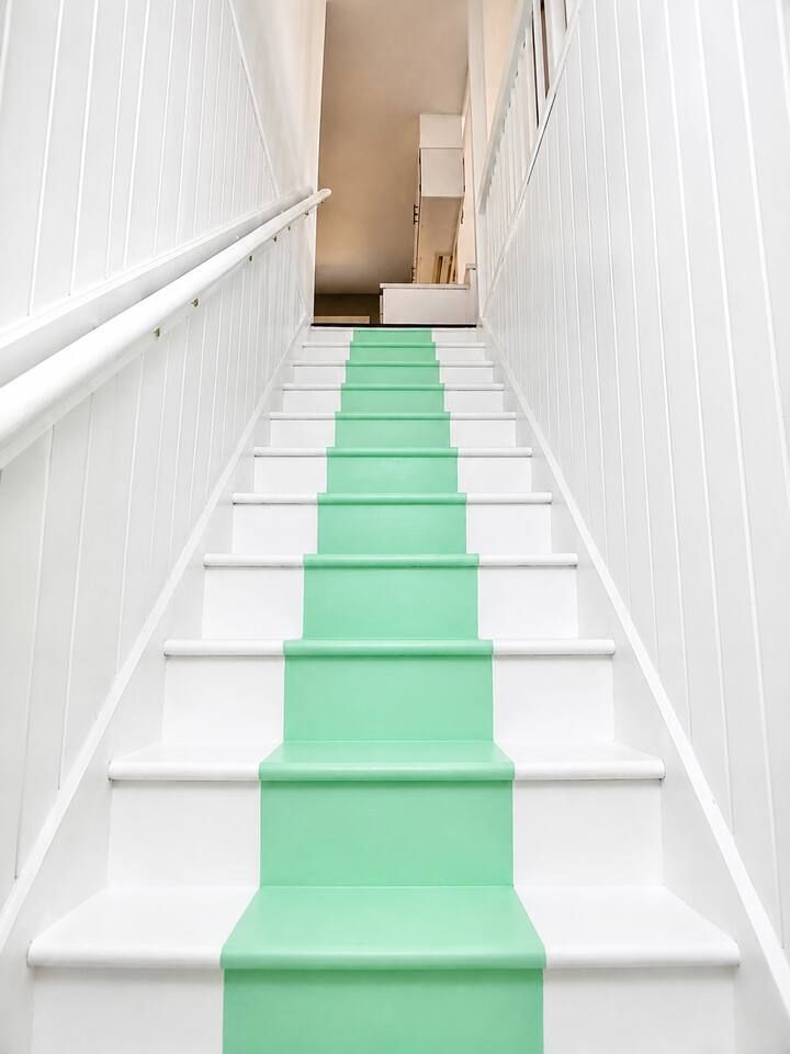 Up the designer striped stairs to the top floor.