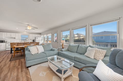 Living room, with Dining room and Kitchen beyond