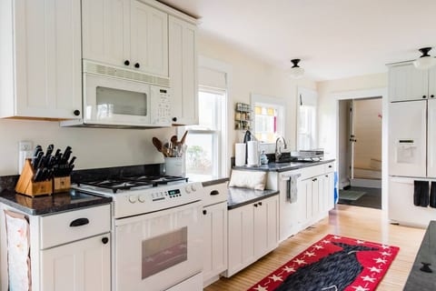 Sunny kitchen with water filter on fridge and new stove in 2022. See other photos for close up of the new stove.