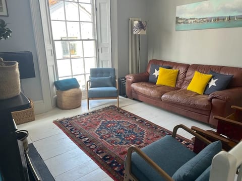 Cosy lounge with comfy sofa, Roku TV and wood burning stove