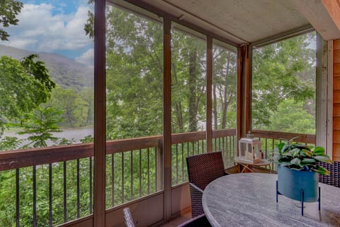 View of Lake Taneycomo and hillside of trees.