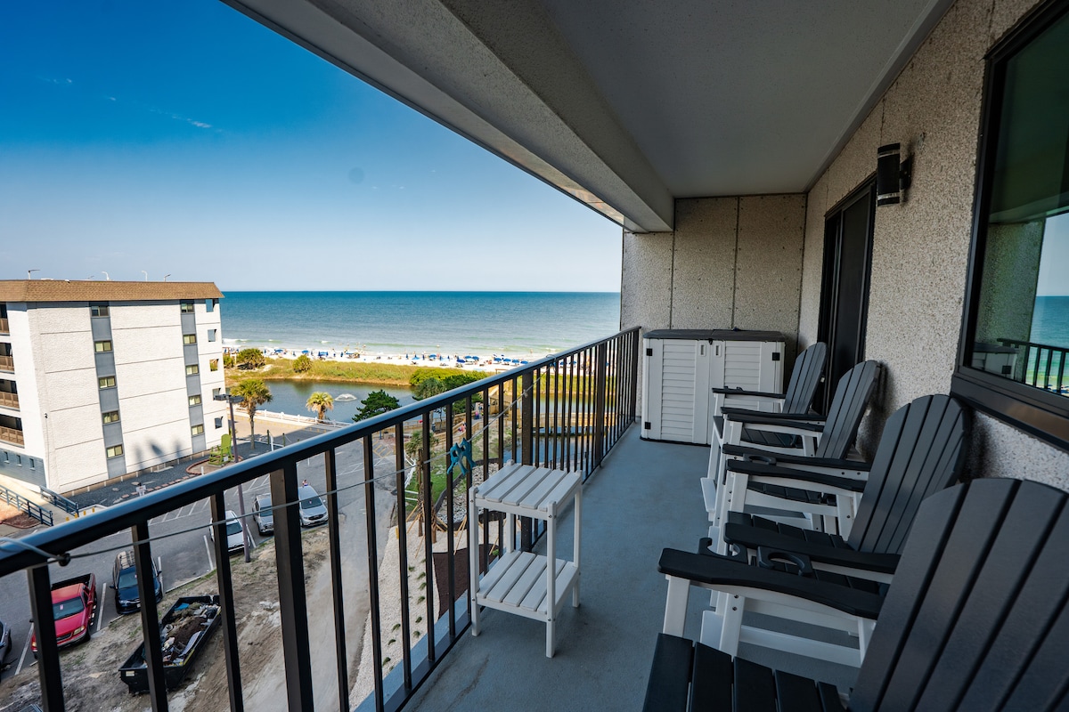 Unwind on our ocean view balcony, sinking into the comfort of our comfortable plywood chairs, while enjoying your favorite drink.