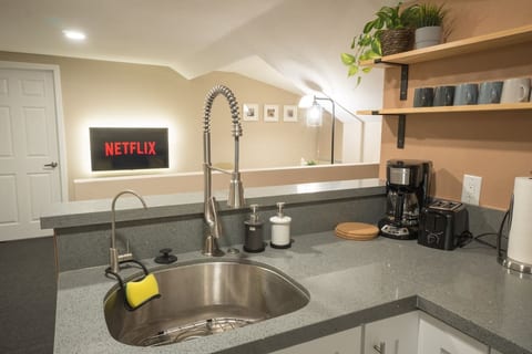 Open kitchenette with direct TV view. Perfect for cooking a delicious meal while enjoying your favorite movie on Netflix!