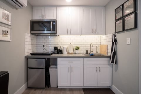 Full kitchenette for all your simple cooking needs. Comes with electric cooktop, microwave, mini fridge, filtered water, coffee maker, toaster, and hot water boiler.