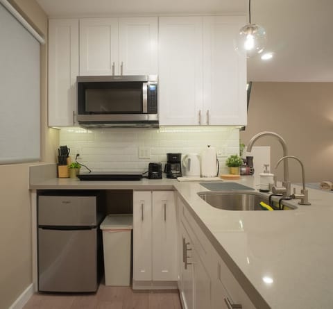 Full kitchenette for all your simple cooking needs. Comes with electric cooktop, microwave, mini fridge, filtered water, coffee maker, toaster, and hot water boiler.