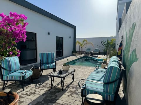 The kitchen provides effortless access to both the terrace and pool, creating a perfect flow for indoor-outdoor living and entertaining.