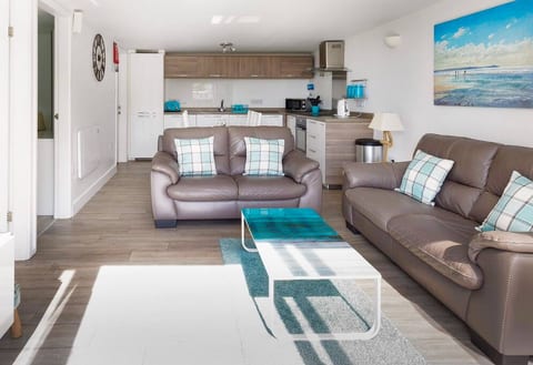 Lounge with dining and kitchen to the rear. Still with sea views!