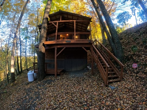 Secluded hillside cabin with covered deck in a stunning wooded setting