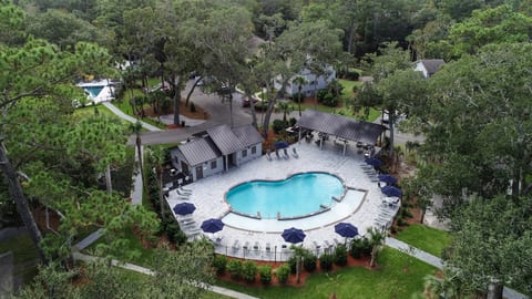 Pool #1 featuring large cabana with seating/dining area. Has zero depth area and bathrooms.