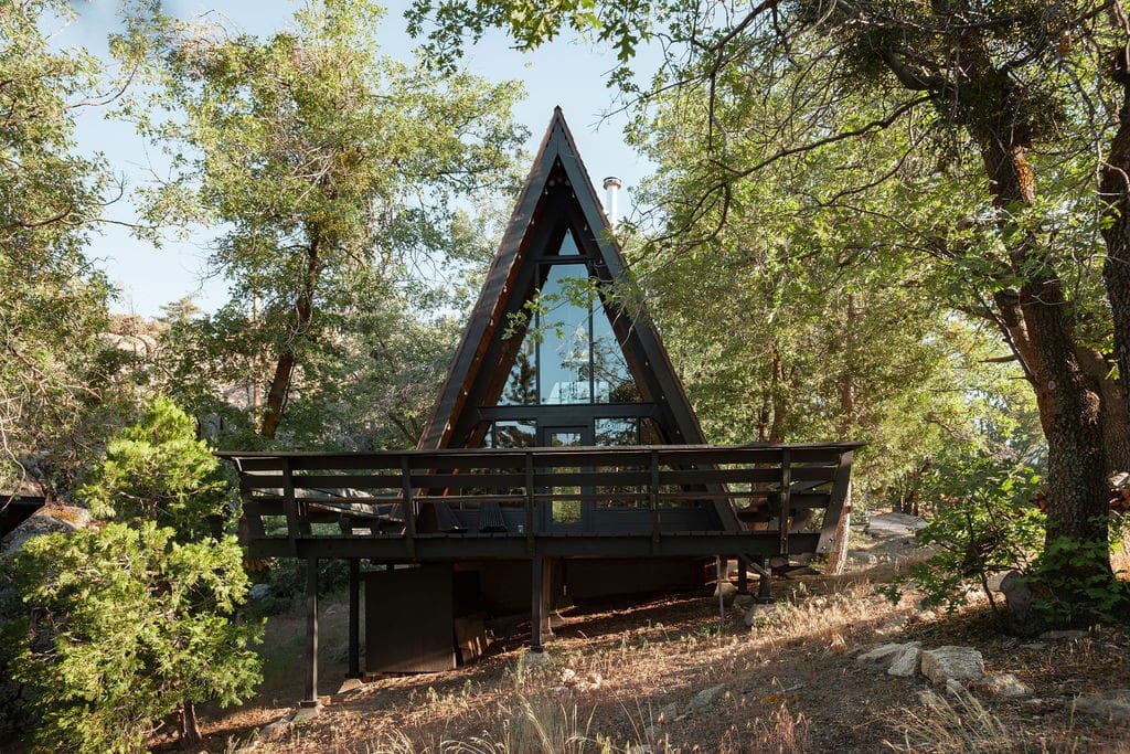The Tiny Triangle A-Frame Cabin, sitting proudly in the summer sun.