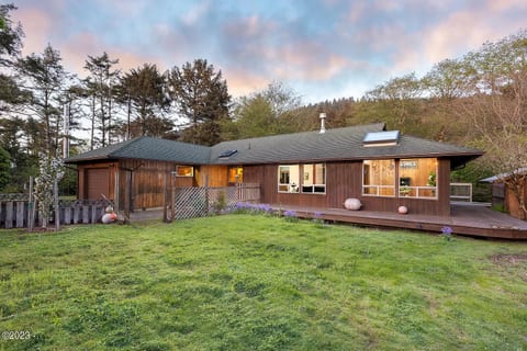 Large front yard and wraparound deck