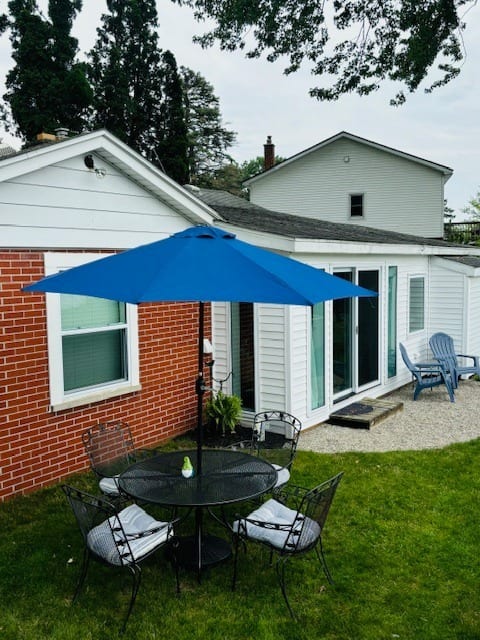 Backyard dining, gathering and grill (not pictured) area