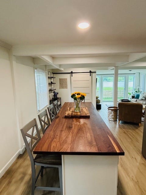 Large walnut kitchen island seats 5 (6th chair is stored in garage. Let me know if you need it)!