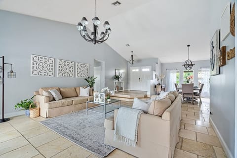 Walk in and be greeted by the spacious great room with two oversized couches, vaulted ceilings with views of the pool. Fort Lauderdale Area Pool Home. Family Friendly.