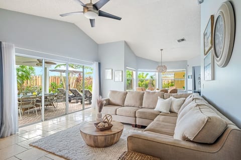 Family room with sectional couch and SmartTV perfect for winding down in the evenings. Fort Lauderdale Area Pool Home. Family time!