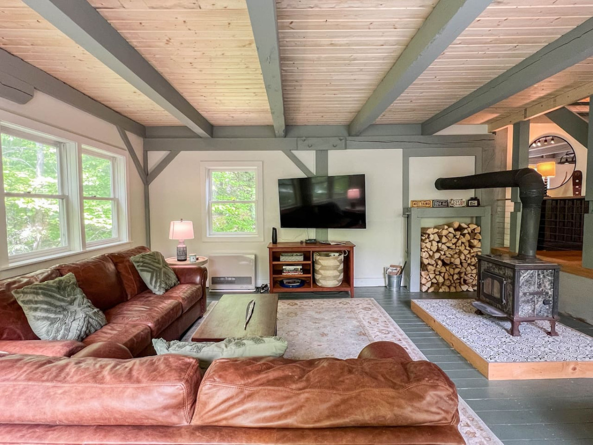 When you are sitting in this roomy but cozy living room you can hear the rushing water of the brook.  You also can easily interact with the goings-on of the kitchen and dining areas.