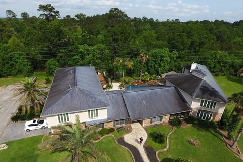 Beautiful aerial view of front house with wonderful nature surrounding the property