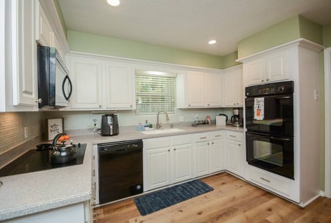 Full Kitchen with double oven, airfryer, coffeemaker, tea kettle, etc.
