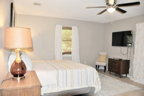 Our master bed with Amazon Fire TV and King Size Bed and private bath/shower.