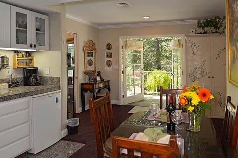 Kitchen area out towards private deck and yard.