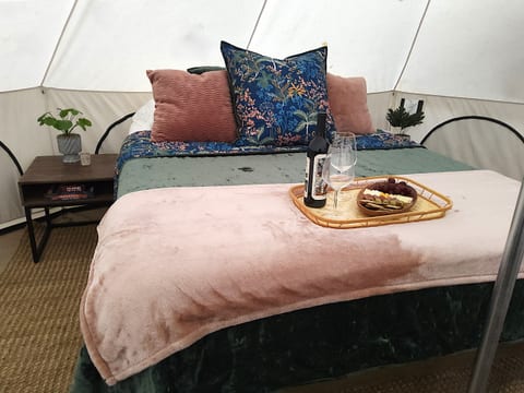 A lavishly cozy bed for an elevated glamping retreat.