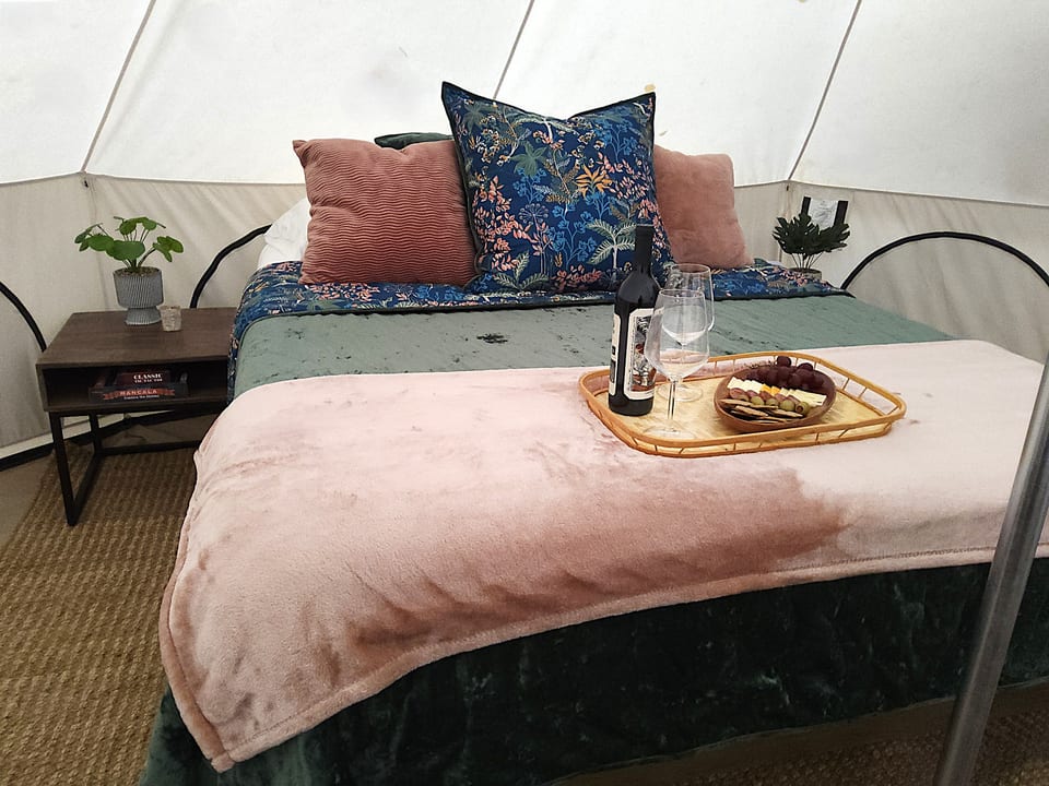 A lavishly cozy bed for an elevated glamping retreat.